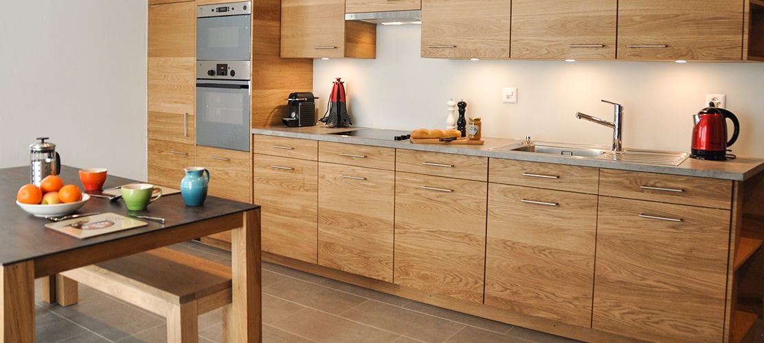Stylish kitchenette with plenty of storage and facilities