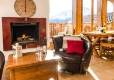 Log fire and leather seats in the Penthouse Chalet lounge