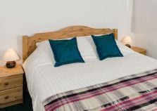 Crisp sheets on a chalet double bed