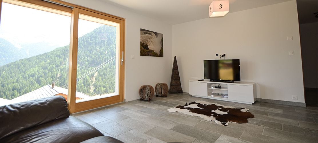 Open plan living area in Chalet Pic Blanc
