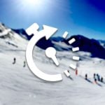 Blurred ski slope scene with time-lapse turner icon overlaid