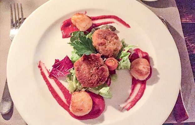 Dainty seared scallops served with pigs trotter