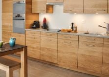 Stylish kitchenette with plenty of storage and facilities