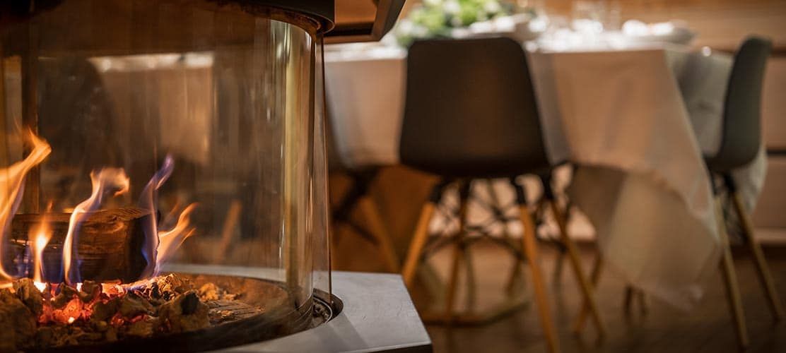 Log fire burning in Courchevel catered chalet