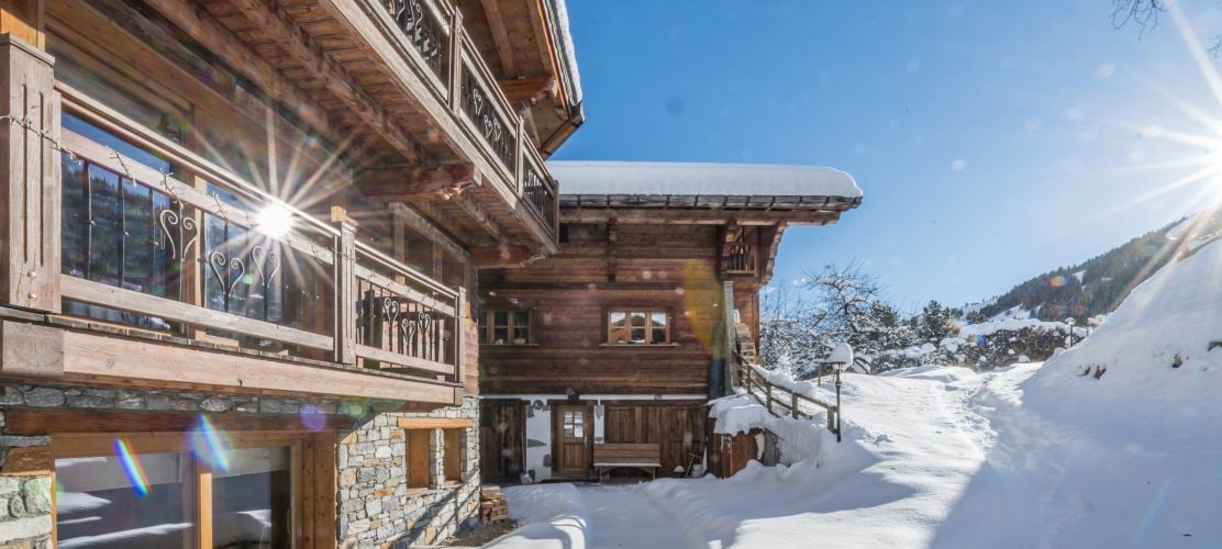 Log fire burning in Courchevel catered chalet