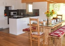 Large open plan living and dining area in Chalet Pic Blanc