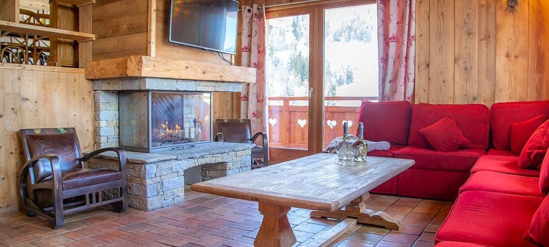 The lounge with log fire at Chalet Le Lievre