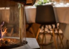 Log fire burning in Courchevel catered chalet