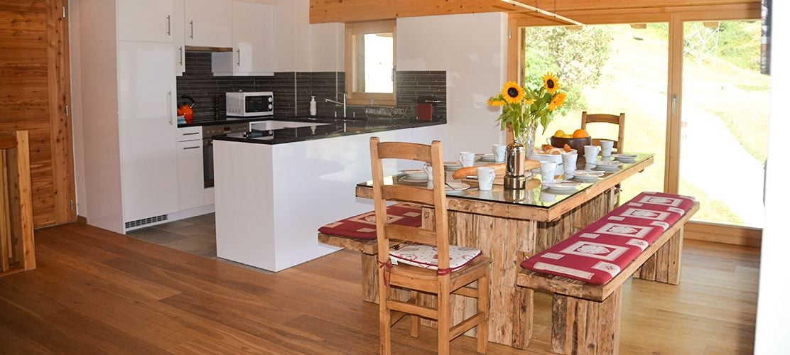 Large open plan living and dining area in Chalet Pic Blanc