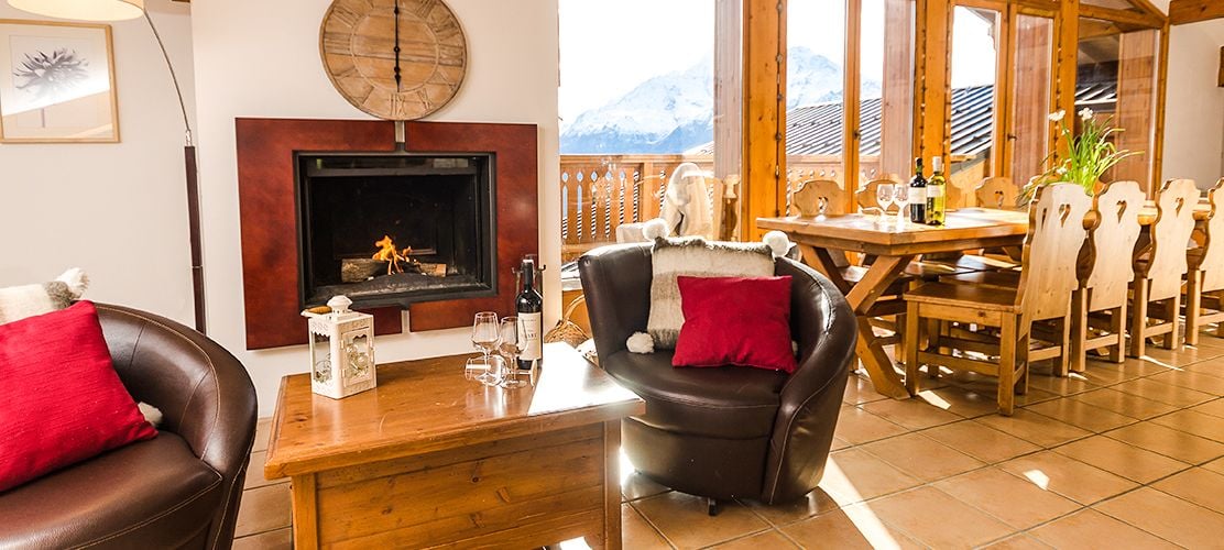 Log fire and leather seats in the Penthouse Chalet lounge