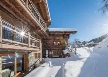 Log fire burning in Courchevel catered chalet