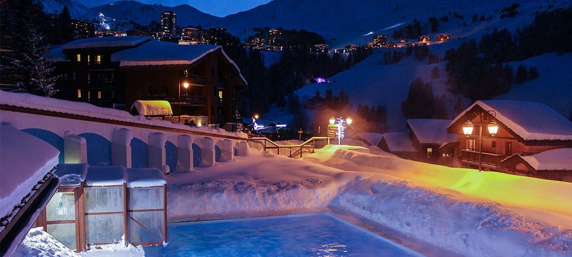 The exterior of Chalet Grand Chardon within a complex with a private swimming