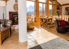 A huge living space in the chalet with full length windows