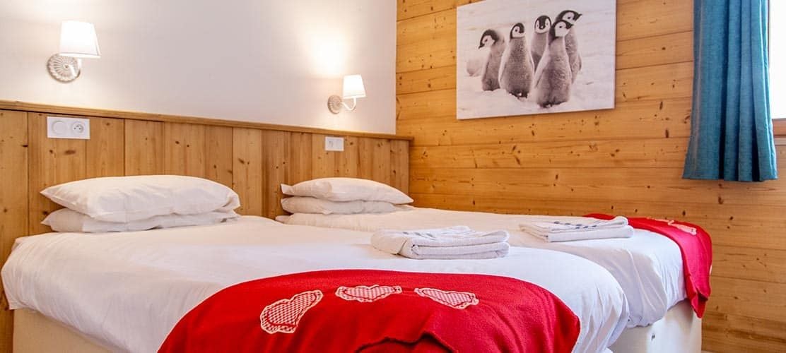 Twin bedroom in catered chalet