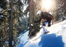 Off piste skiing in the trees by Courchevel Le Praz